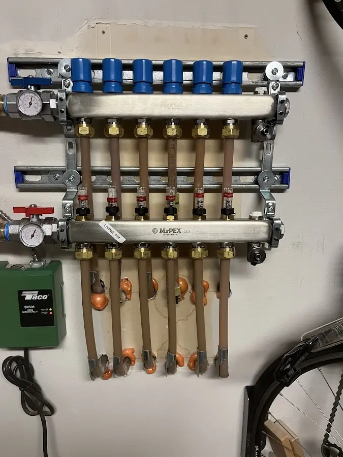 Plumber performing Water Heater Repair at a residential property in Wharton